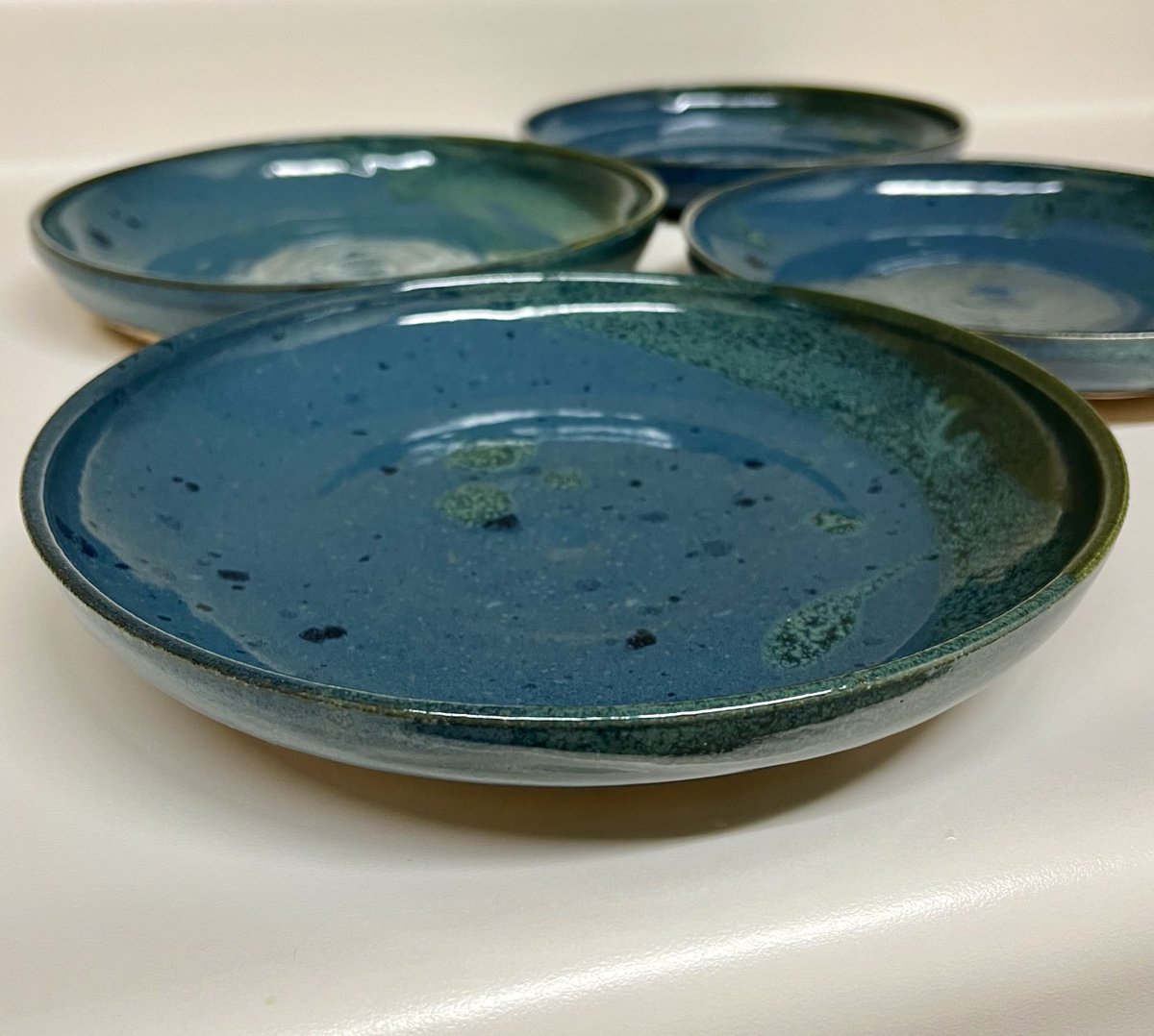 melostrom's tweet photo. My grandma was admiring my pasta bowls when she visited earlier this fall, so I thought I’d make her a set for Christmas. Glazed them glossy green &amp; Mediterranean blue. Hope she likes how they turned out. Happy Saturday, friends. #pottery 💚🩵🎄 https://t.co/ZZBFNt0pQ3