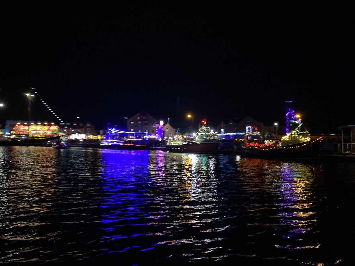 Santa arrives at #PortofWells from the #NorthPole, under an exploding #NorthNorfolkCoast sky. Escorted by a flotilla from the #WellsNexttheSea fishing fleet.