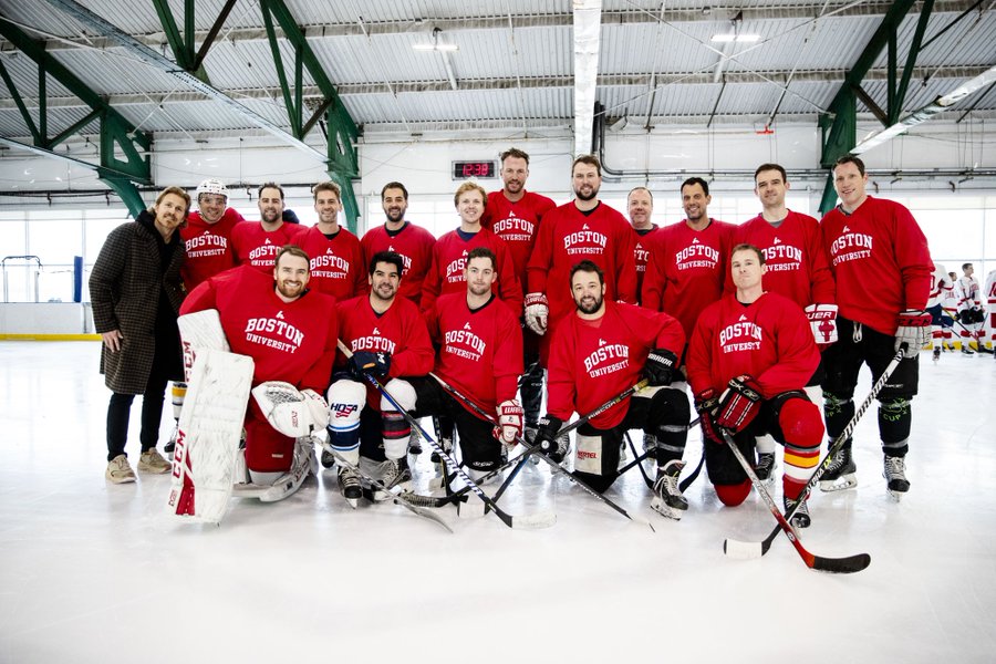 BU men’s hockey alumni take a group photo at Chelsea Piers before an alumni game against Cornell.