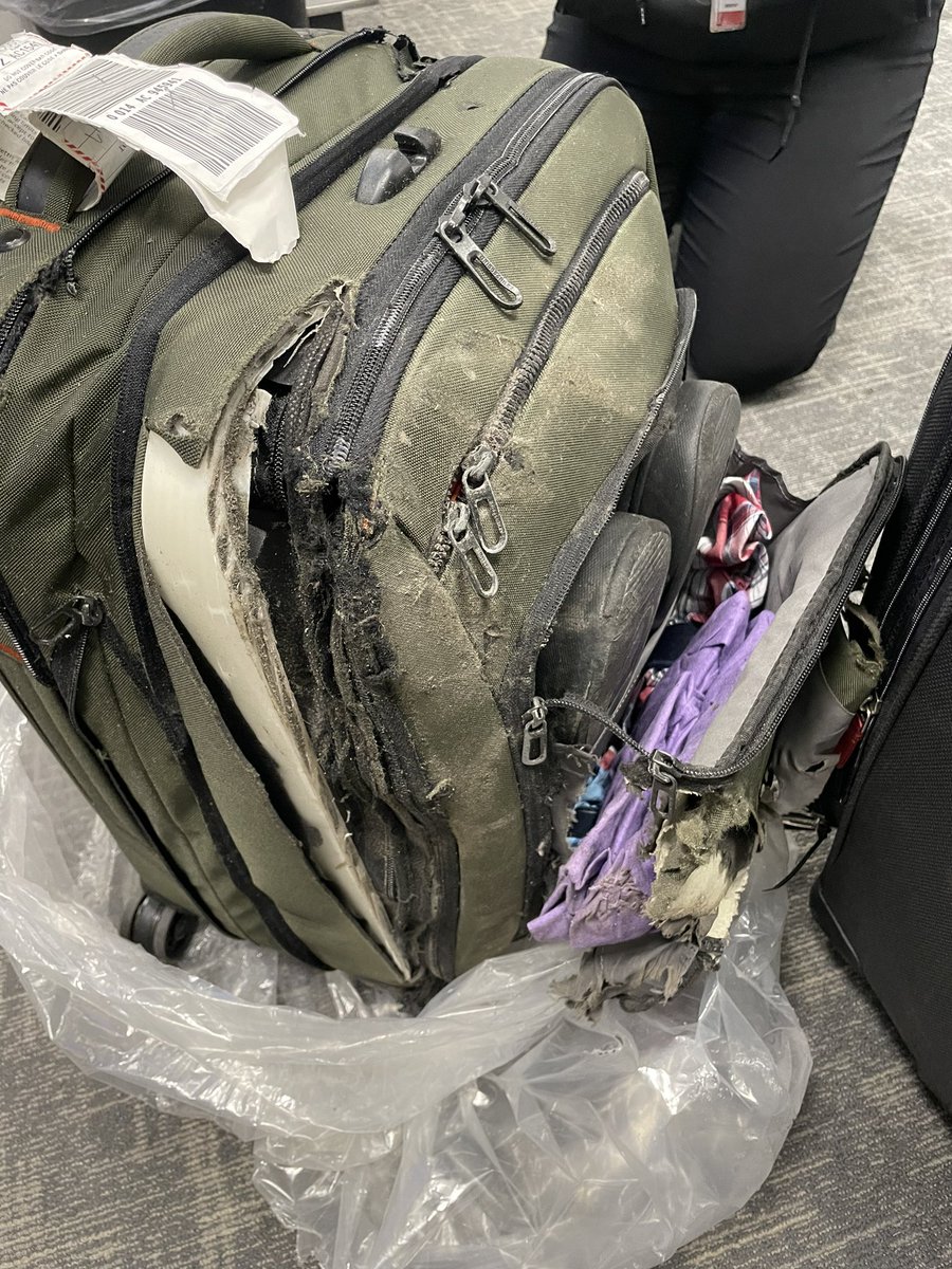 SkotWelch's tweet photo. @BriggsandRiley I can’t make this up. This was BRAND NEW and then it met @AirCanada caring staff. https://t.co/70uEkMDnaC