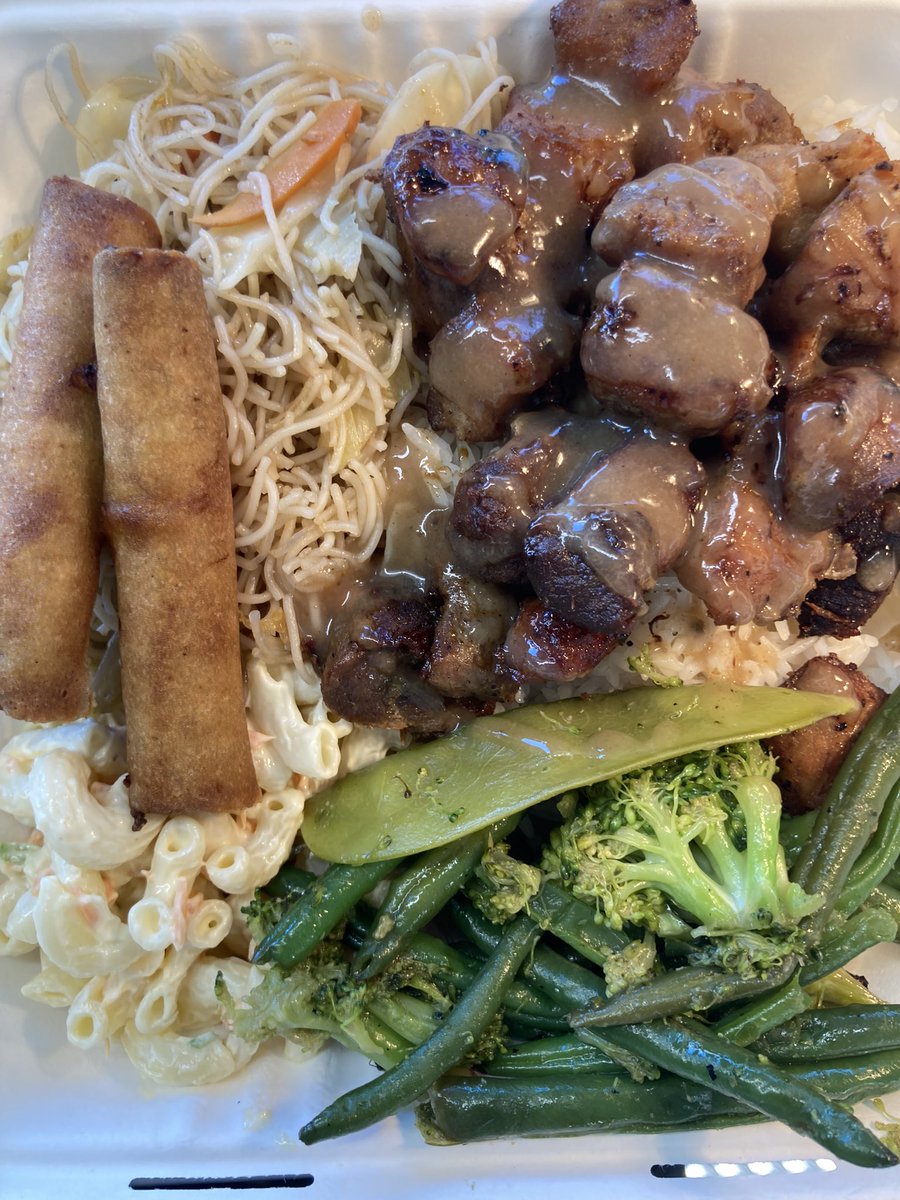 Filipino Crispy pork adobo topped with Mang Tomas sauce; served over jasmine rice, with Filipino Pancit bihon noodles, vegetable chop suey and Hawaiian Mac Salad