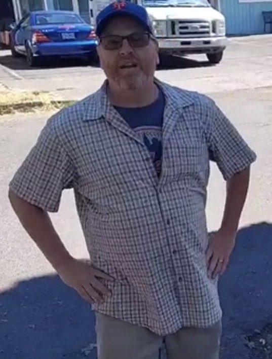 Uri Kushner, seen here defending the hostile architecture he placed across from his business, Dairy Hill Ice Cream, on Hawthorne