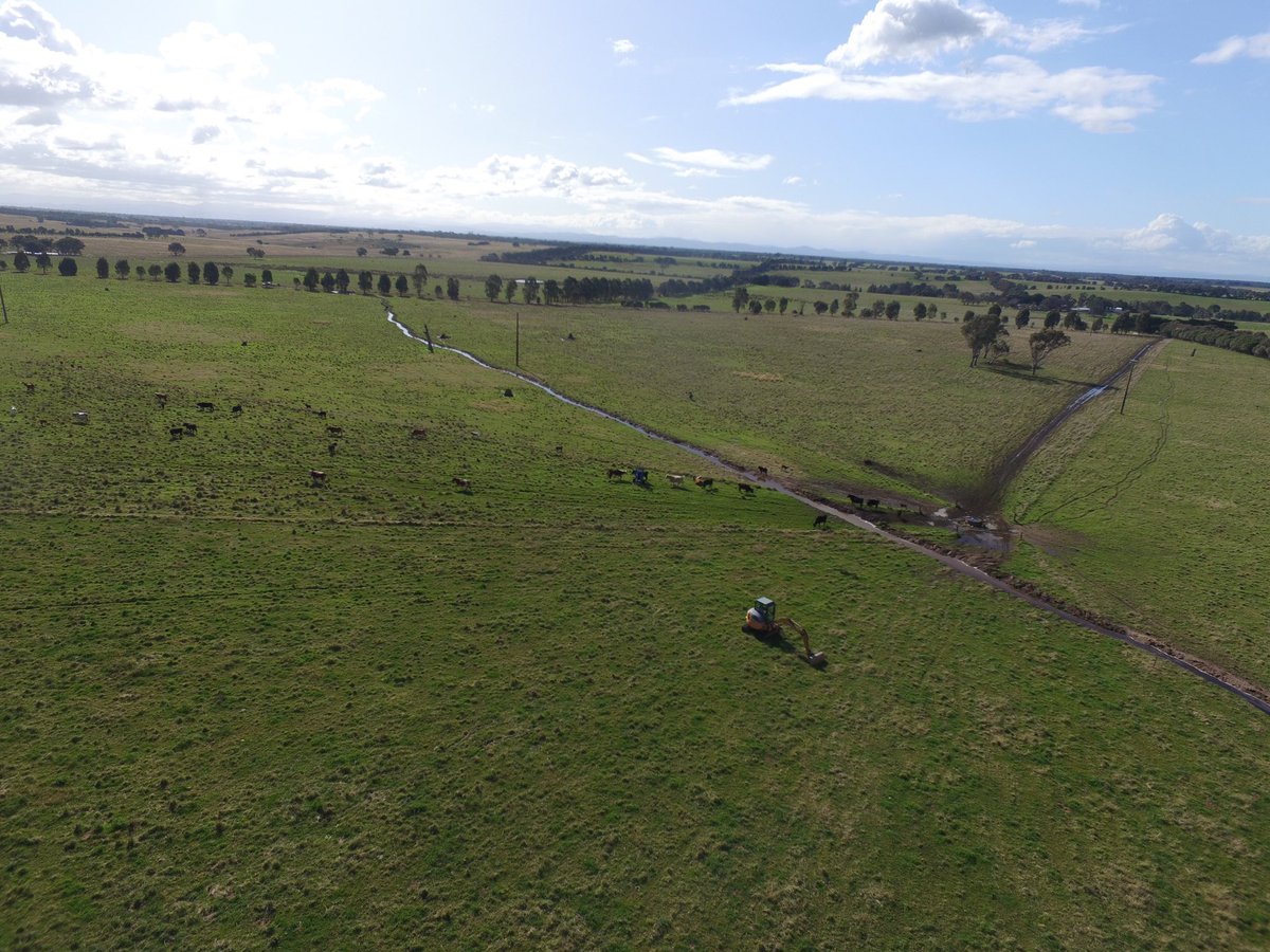 RuthRead13's tweet photo. Our new yellow toy with keen astute operator has formed a contour swale across a couple of paddocks. Pretty impressed with how it is slowing the flow and holding water higher in the landscape. https://t.co/7vS8pSQw7u