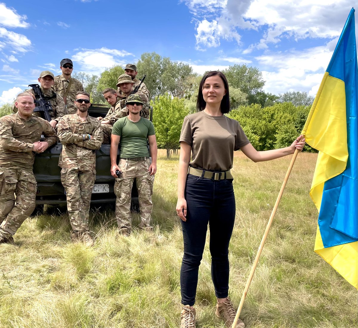 OlenaChek's tweet photo. Today #Ukraine is celebrating the Day of the National Flag 🇺🇦 
Blue symbolises the skies over our land, yellow denotes the grain growing in the vast fields beneath. 

And here are my brave students, who are now fighting for this land. https://t.co/H8RMjK1tZ1
