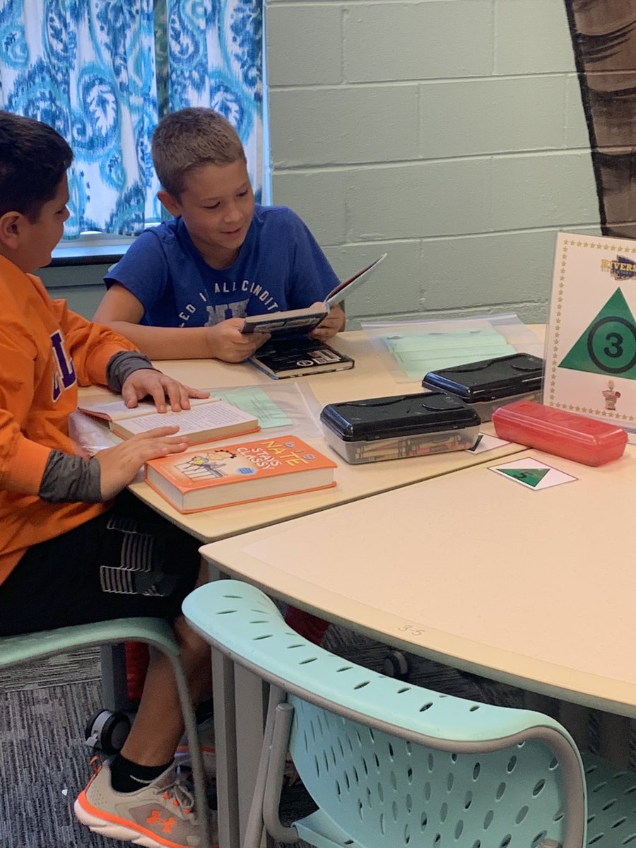 Riversidereads's tweet photo. Reading in the library. What could be better! #HCSLibraryMedia https://t.co/CWFYX9xzsv