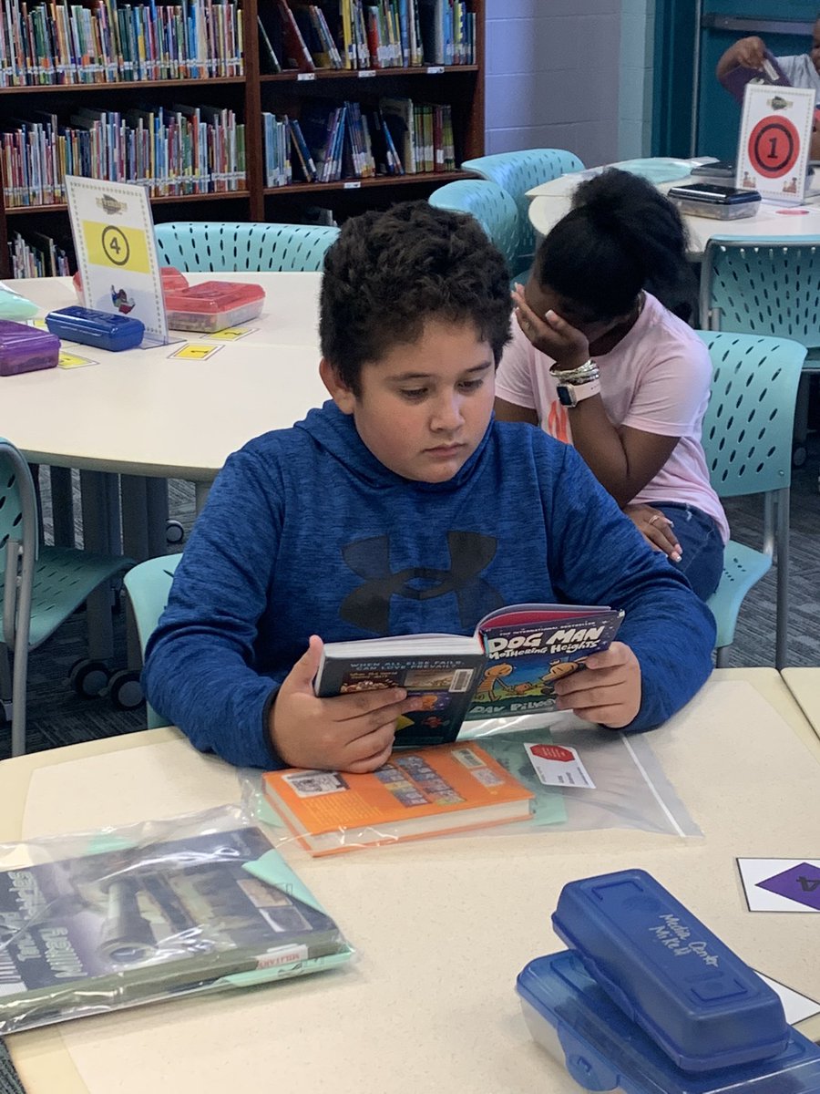 Riversidereads's tweet photo. Reading in the library. What could be better! #HCSLibraryMedia https://t.co/CWFYX9xzsv