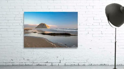 Opposite the setting sun a layer of low clouds appears just behind Morro Rock in Morro Bay California. 
#BuyIntoArt #FindArtThisSummer #MorroBay #MorroRock #CentralCoast #wallart #Beach
GET IT: buff.ly/3PJdvRs
