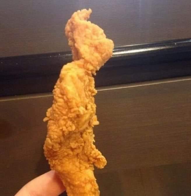 Nate_FFL's tweet photo. Am I being ridiculous, or does this chicken tender look exactly like the Grinch is masturbating? 👀👀 https://t.co/CgABXgg1ZZ