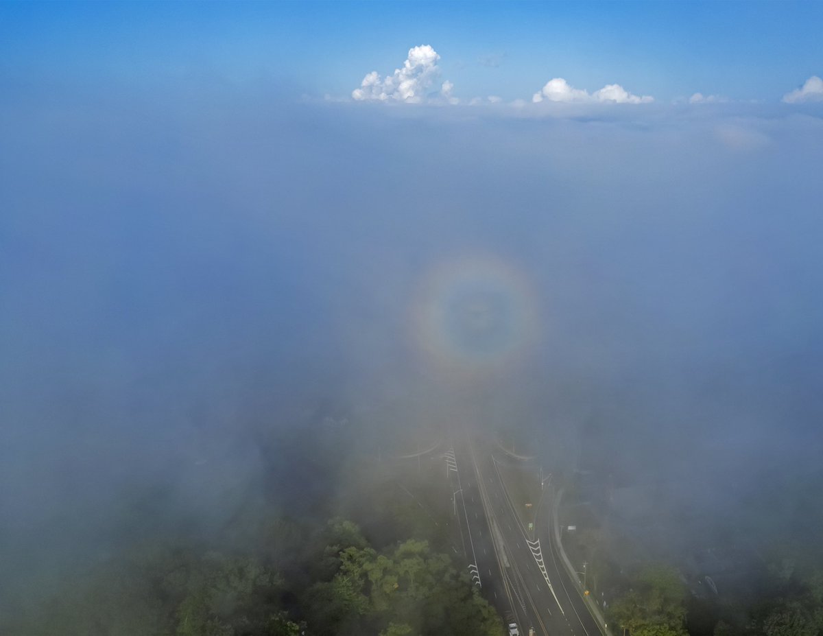 ABPhotography83's tweet photo. Being in the right place, at the right time, at least my drone was. The Brocken Spectre or Brocken Bow. appears when the sun shines from behind the observer (or drone), who is looking down from a high elevation into mist or fog. Lucky shot or good timing? .

.

.

. https://t.co/dTb8OOKH5O