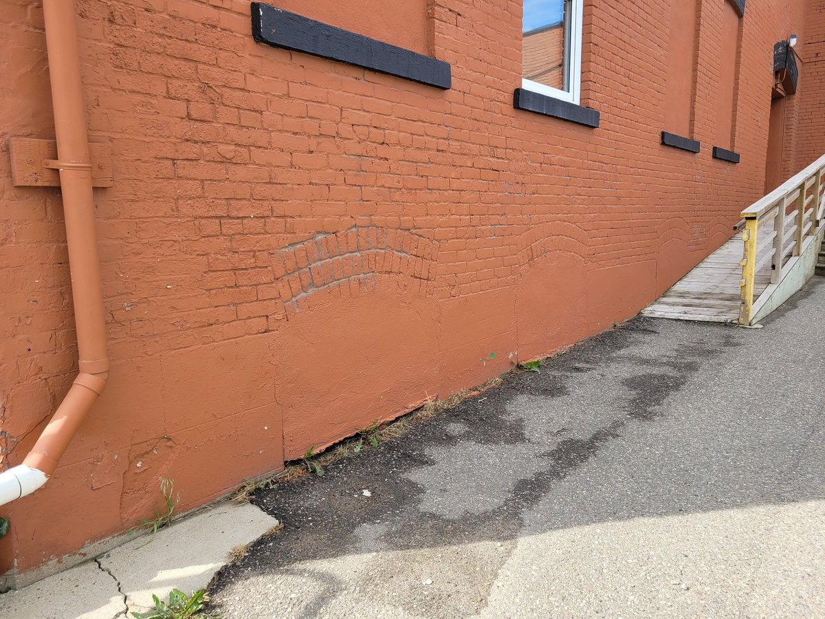 BelindaCrowson's tweet photo. Oh, the things you find when you take a walk, including an amazing chalk mural, covered in windows and doors (that tell the story of the bldg) and a sidewalk stamp I previously missed. #Lethbridge #yql https://t.co/lYOfkfBJYi
