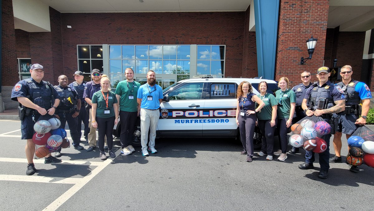 MboroPoliceDept's tweet photo. As part of its community engagement efforts, Dick’s Sporting Goods at The Avenue in Murfreesboro donated soccer balls, volleyballs, kickballs, and footballs to MPD to give to children in the community.  Several MPD officers were on hand to accept the donation.  #dicksportinggoods https://t.co/8diUzNmDo0