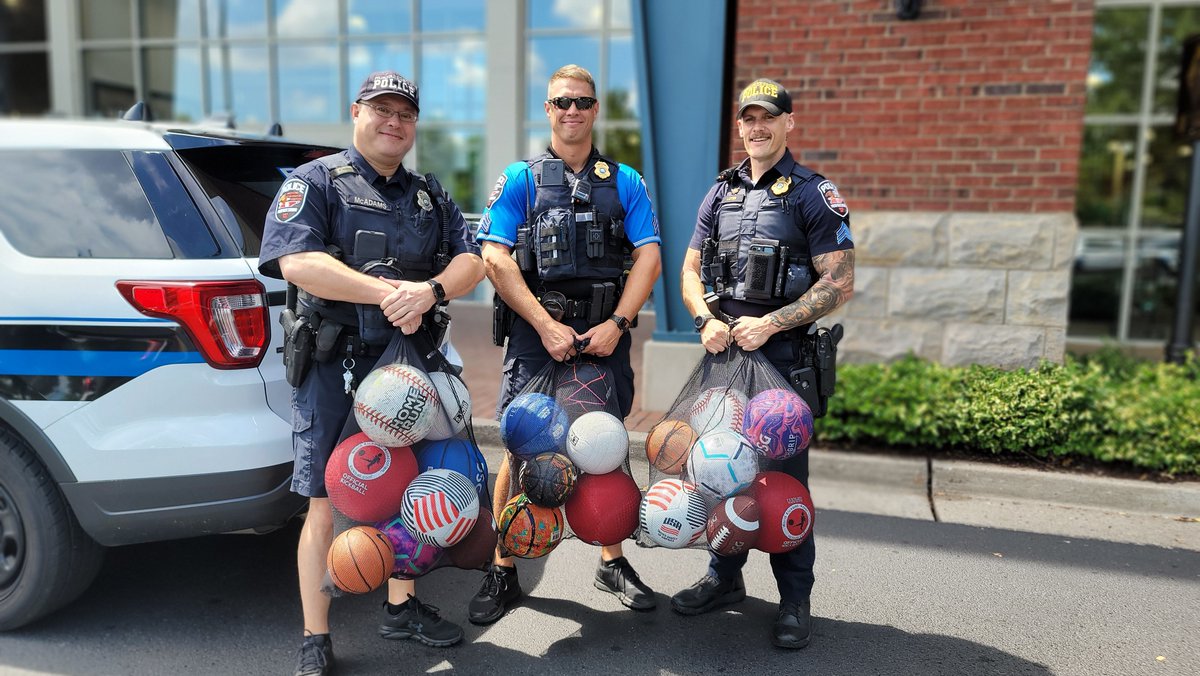 MboroPoliceDept's tweet photo. As part of its community engagement efforts, Dick’s Sporting Goods at The Avenue in Murfreesboro donated soccer balls, volleyballs, kickballs, and footballs to MPD to give to children in the community.  Several MPD officers were on hand to accept the donation.  #dicksportinggoods https://t.co/8diUzNmDo0
