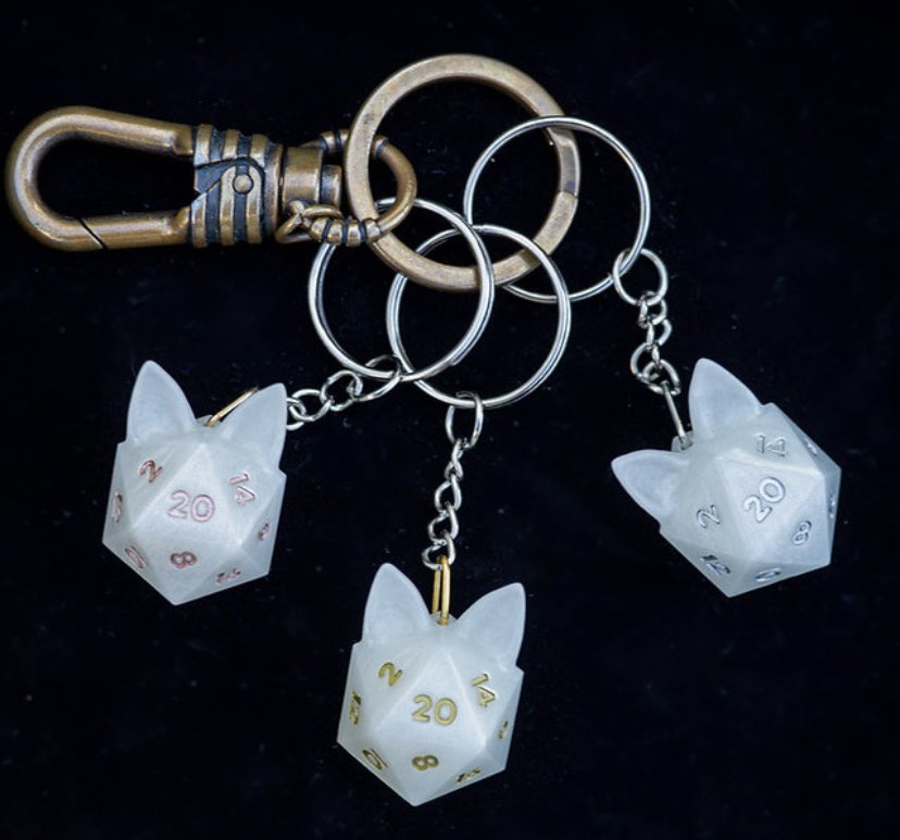 _GrinningKitten's tweet photo. IT IS FINALLY HERE!!!! Get your own iCATsahedron keychain (or earrings or necklaces!) at the shop now!! Link in bio!!

#dnd #dice #cat #handmadedice https://t.co/IWKFxbvCg0