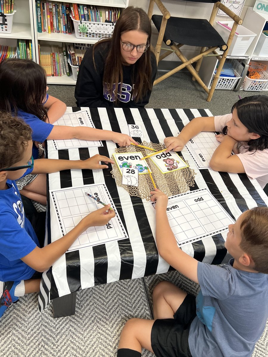 GRE CareCat Mila Seaton mentors with Mrs. Irvin's 2nd graders-- sorting and identifying even and odd numbers. #MENTORirl #MentorKansas #TBW
