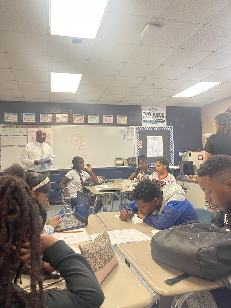 LeslieCRichard2's tweet photo. Clay-Chalkville Middle students exploring integers and number lines in Mr. Clasberry’s class with Math Coach Mrs. Crane #TeamTeachingWorks #StrongerTogether @JEFCOED @Jefcoed6_12  @JessicaSilas17 https://t.co/t9IasIr9Fz
