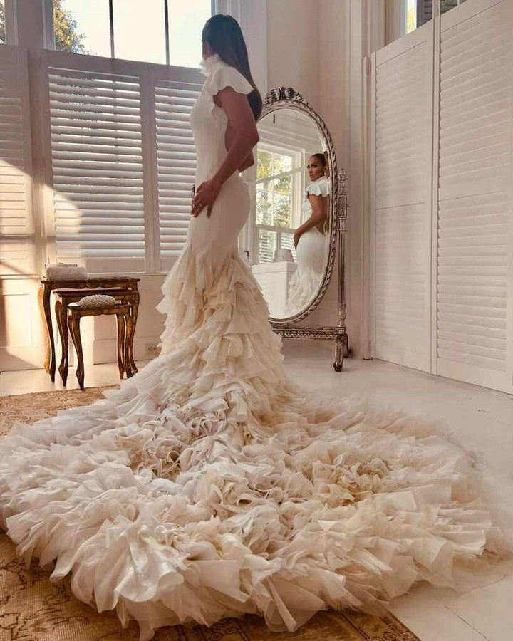 enews's tweet photo. Can we have a little commotion for the dresses? ❤️ See the new pics from Jennifer Lopez &amp; Ben Affleck's Georgia nuptials: https://t.co/xujY7vY11I https://t.co/ncmsL5hBPG