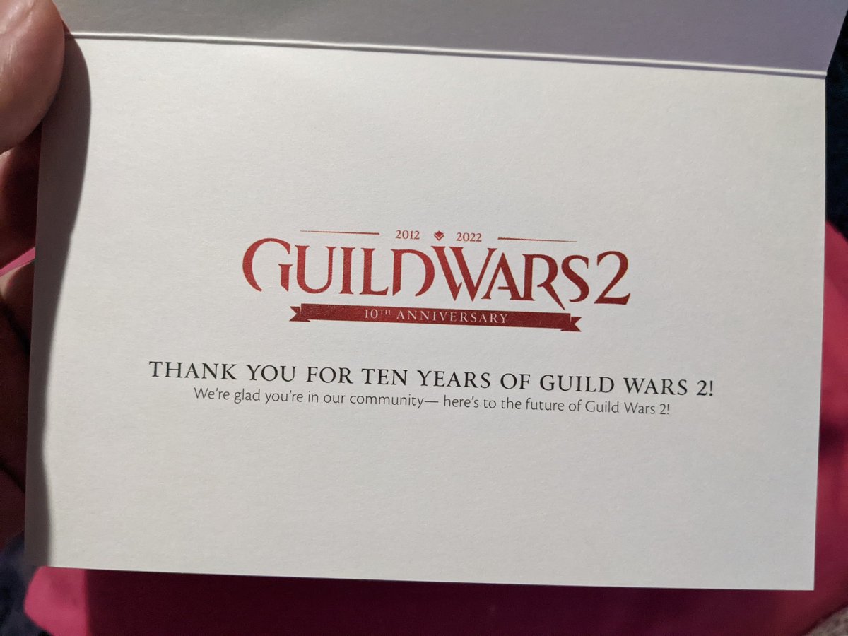 CharGwyl's tweet photo. Happy Birthday @GuildWars2 !!❤️I definitely got a little teary-eyed coming home to this in my postbox, thank youu😭❤️This game and the people I've met through it mean so much to me. Thank you for an incredible 10 years, I can't wait for our future adventures in Tyria! #GuildWars2 https://t.co/6DoonMwvQI