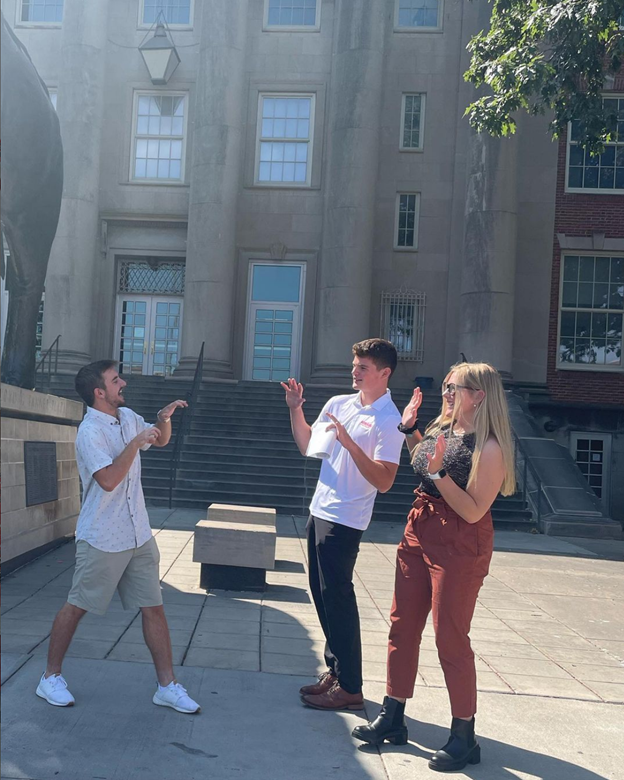 ProfSJF's tweet photo. Builders pose as velociraptors and their frightened prey! Getting out of their comfort zone, as they should. #crazyfirstdayofclass #unlbuilders #unl #nebraskabiz https://t.co/ruQ5vcuVLJ