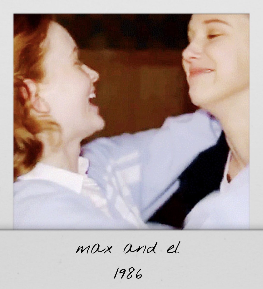 strngerpolaroid's tweet image. dustin takes a polaroid of max and el hugging 
1986