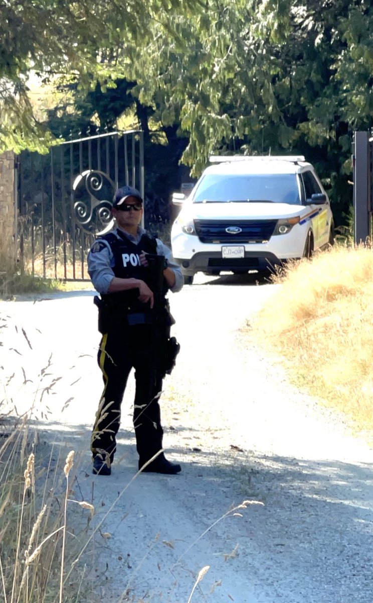 garhan3's tweet photo. Idyllic Salt Spring?  RCMP chopper circling overhead and member guarding gate at residential property with a semi-automatic long gun. Nobody is talking. Lots of questions, no answers. https://t.co/f56QD8DjtP