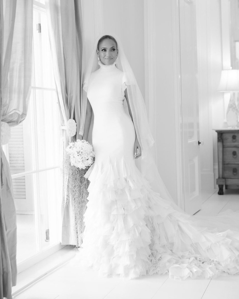 BritishVogue's tweet photo. Introducing the new Mrs Affleck! JLo wore a collared @RalphLauren couture gown for the lavish nuptials – the first of three dresses she wore for the celebrations: https://t.co/3lyRRb3eem https://t.co/bGPQvnpKvp