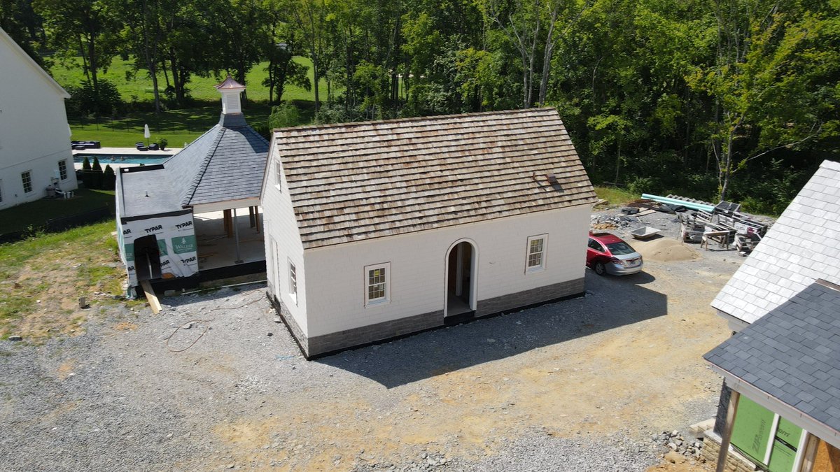 Making significant progress on our client's cedar and slate roof with copper flashing and gutters. This roof is coming out excellent. Architect- Cathryne Tracy Sloan | Builder- Hearington Homes, Inc. #cedarroof #slateroof #copperflashing 🏘️ 🔨