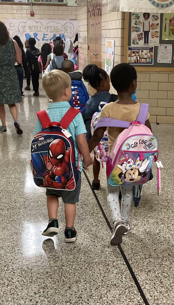 GMASteam's tweet photo. A sweet moment captured of a first grade friend helping a kindergartener get to breakfast this morning! Love our sweet students! 💚👩🏿‍❤️‍👨🏼 #KCSRegion5 https://t.co/9aSPkSh9fk
