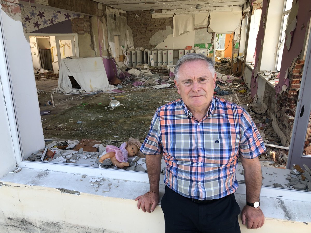The Irish tricolour with bullet holes flying among the flags of the EU in Irpin Ukrainian Hero City where the Russian invasion forces were stopped on route to Kyiv.