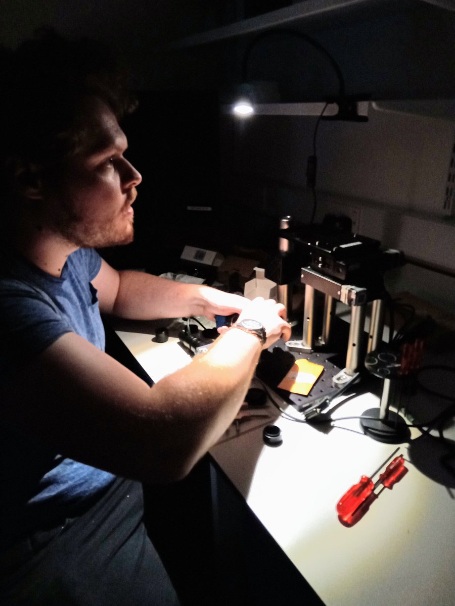 Team member Tom Wareing assembling the SQUID microscope in the SUGAR darkroom.