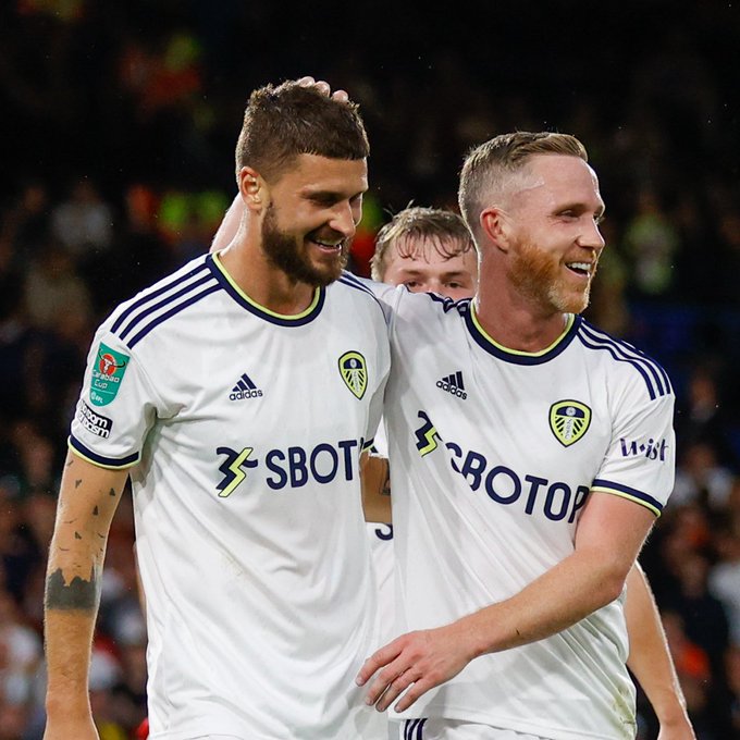 Mateusz Klich and Adam Forshaw celebrate after the former scores against Barnsley in the Carabao Cup