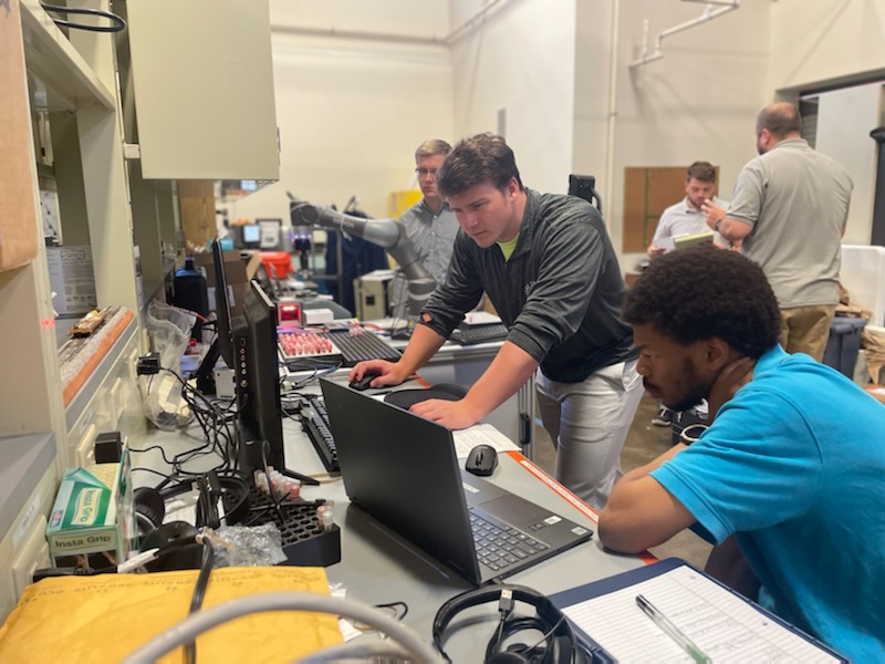Andrew Mott '24 (center) is onboarding two new YCP students, Luke Landis '23 (left) and Josh Hall '23 (right), to work with the PMIP research grant focused on robotics and lab automation. MRG Labs is providing students with real-world research applications right here at YCP!