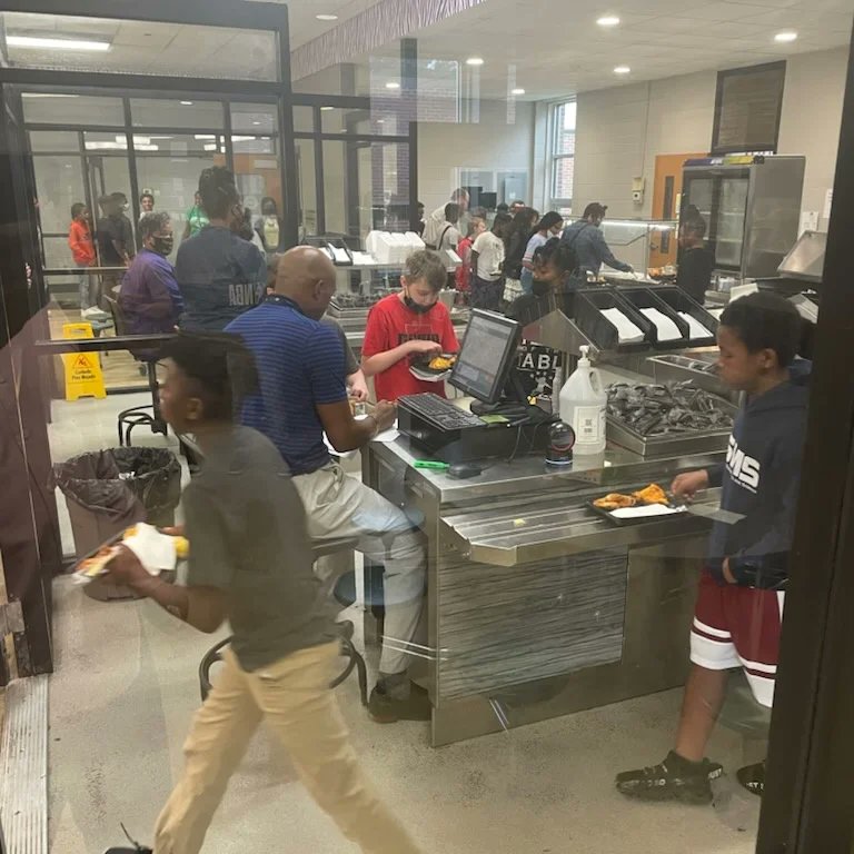 MinorMiddle's tweet photo. The servant-leader is servant first… Mr. Everett helps serving in the Tiger Cafe during lunch today. @jefcoed #minormiddle #minorms #MinorStrong #servantleader #leader #administration https://t.co/5qui0h7RDs