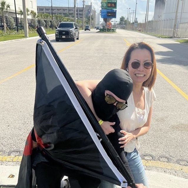 MIAagainstFash's tweet photo. Here’s Lynn at a Floridians First rally “wrestling” w someone dressed up as “antifa” which we identified as Jan 6 Proud Boy rioter Alesandro “Al” Valentino or #ButterFingerPB.
Despite her Proud Boy association Lynn sits on Asian advisory boards @NaaapMiami @mdcaaab @LevineCava https://t.co/vdc7B4spnO