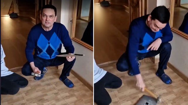 Earthmerica's tweet photo. Russian dad smashes Apple iPad with a hammer to protest American sanctions despite already paying for the product (March 2022) https://t.co/SwEjH3HryX