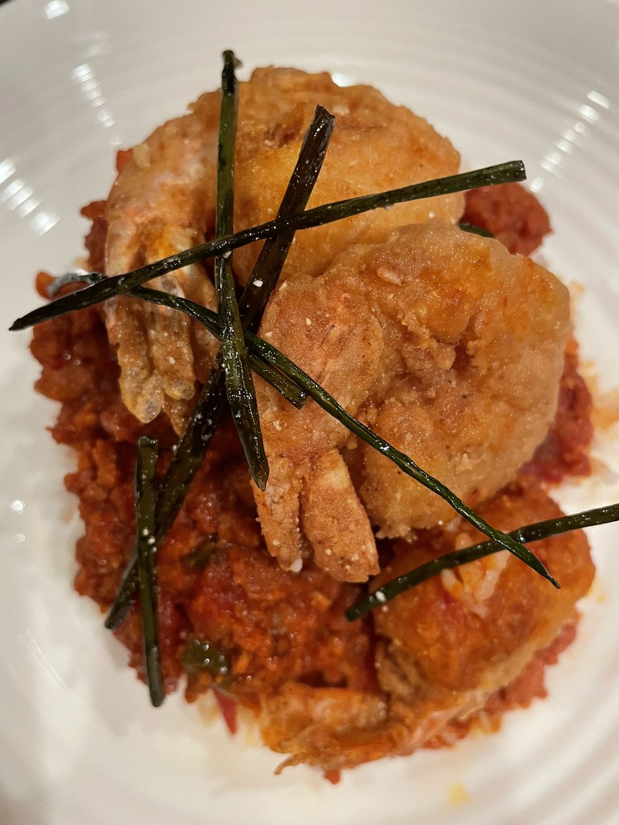 Chorizo and stewed tomatoes topped with crispy shrimp atop rice. #foodie #foodbeauty #foodblog #foodblogger #food #wednesdaythought