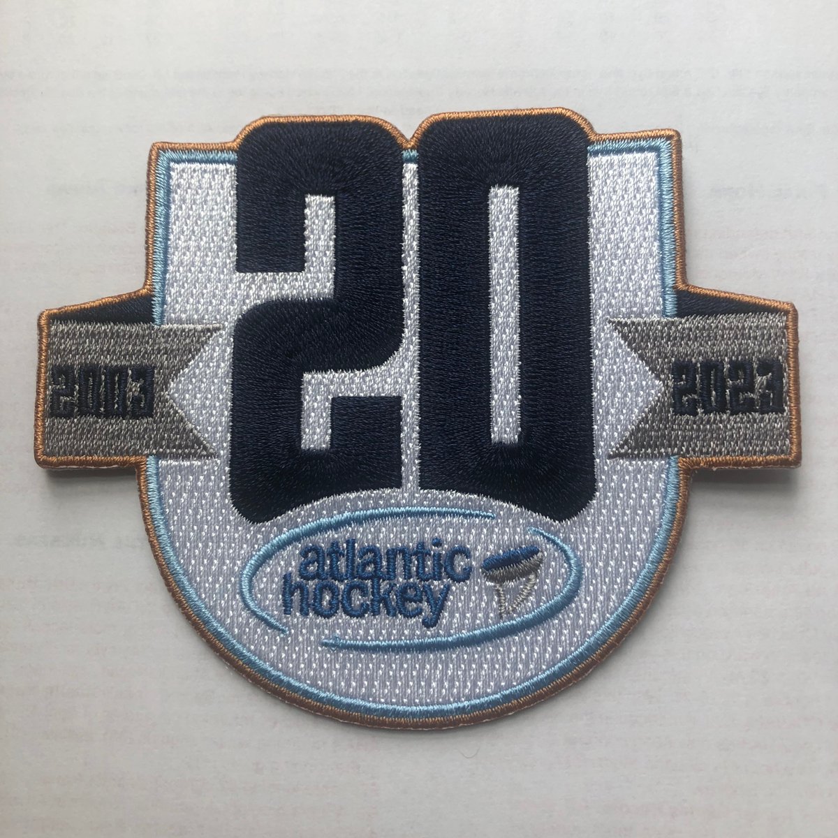 Atlantic_Hockey's tweet photo. Coming soon to an Atlantic Hockey sweater near you... 

#AHA20 https://t.co/qJYnijZlCl