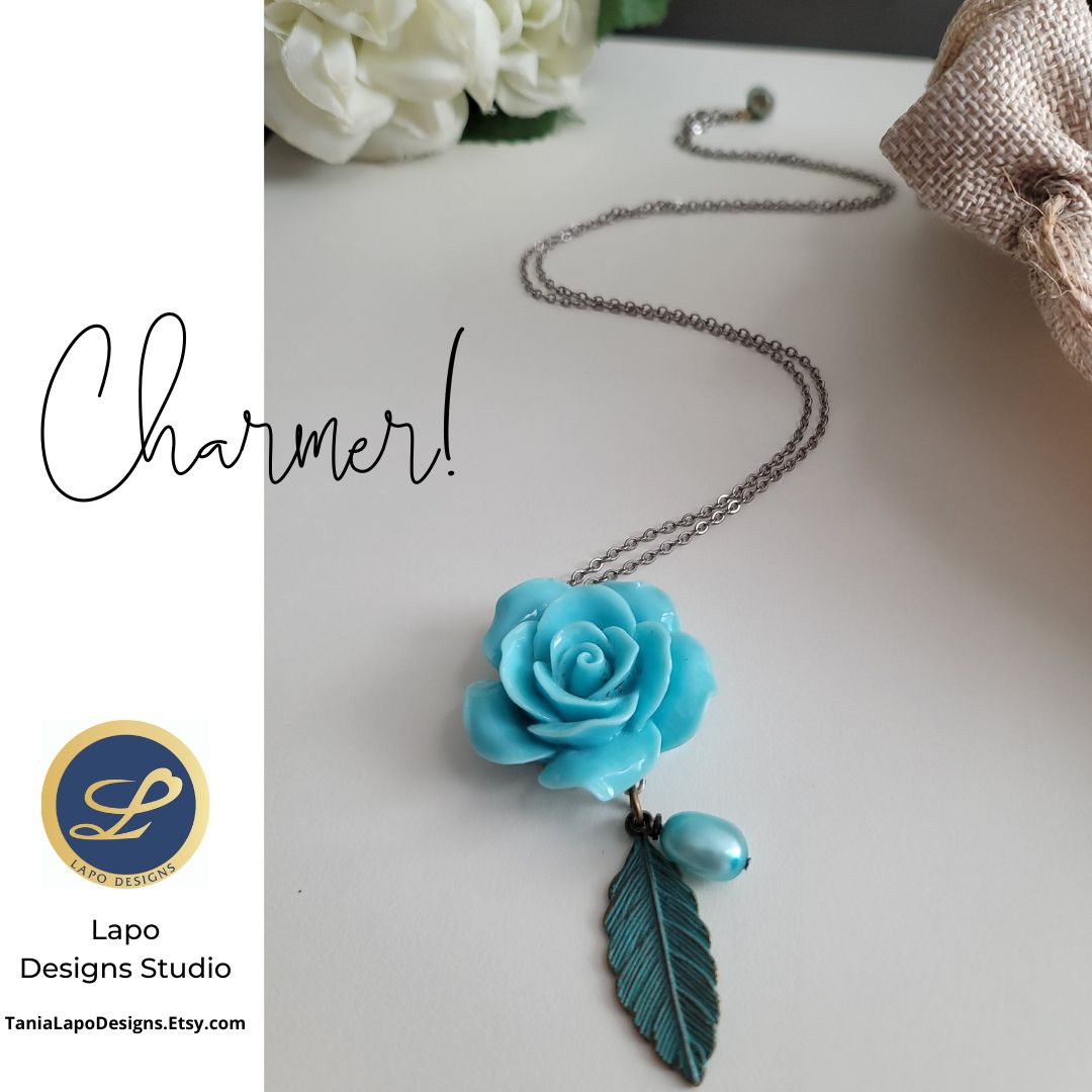 LAPODESIGNS's tweet photo. Some like it simple and creative and yet a charmer. 
To find out your charming vibes send the rose in fashion  blue on a necklace.
#womenjewelrygift #bluerosenecklace #charmingstyle #bluecharm #charmingvibes #charmnecklace #tanialpodesignstudio
https://t.co/cgUuiTBtnQ https://t.co/IZ9X9tUhxq