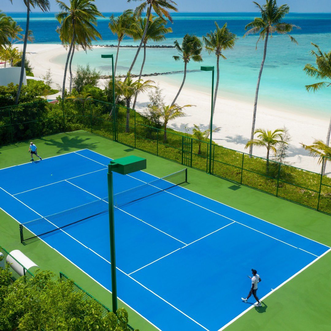How about a game of Tennis surrounded by the swaying palm trees and lush greenery? 🎾🏝
.
.
.
.
📸: @jumeirahmaldives 
.
.
.
.
#ansamatravel #tennis #beautiful  #luxurytravel #sportsphotography #instagood #spain🇪🇸 #rafanadal #serbia🇷🇸 #djokovic #switzerland🇨🇭 #rogerfederer