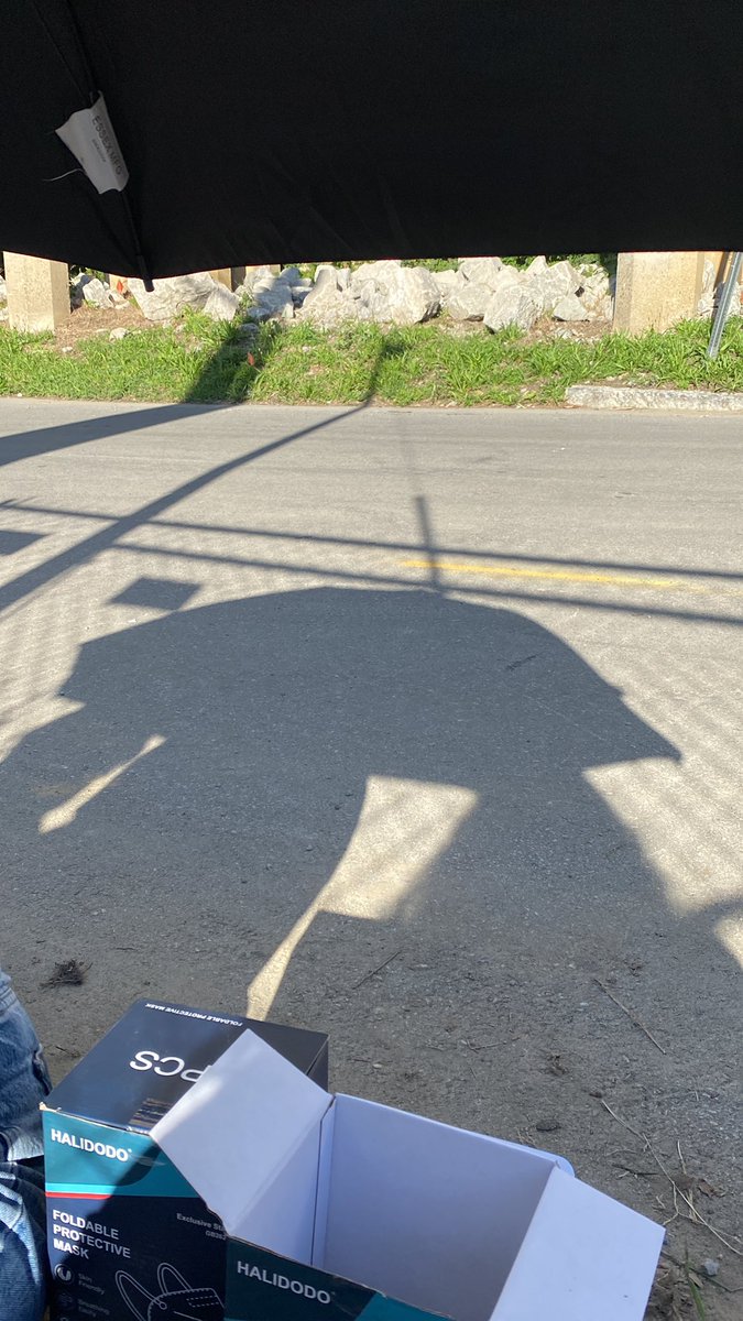 hyesevl's tweet photo. still handing out masks (and stickers!!) we just are now under the big black umbrella sitting on a black and white towel!! still in the same spot in line!! just around the bend of the fence in front of the train track/bridge #loonainlouisville https://t.co/Ys1nPgVMPx