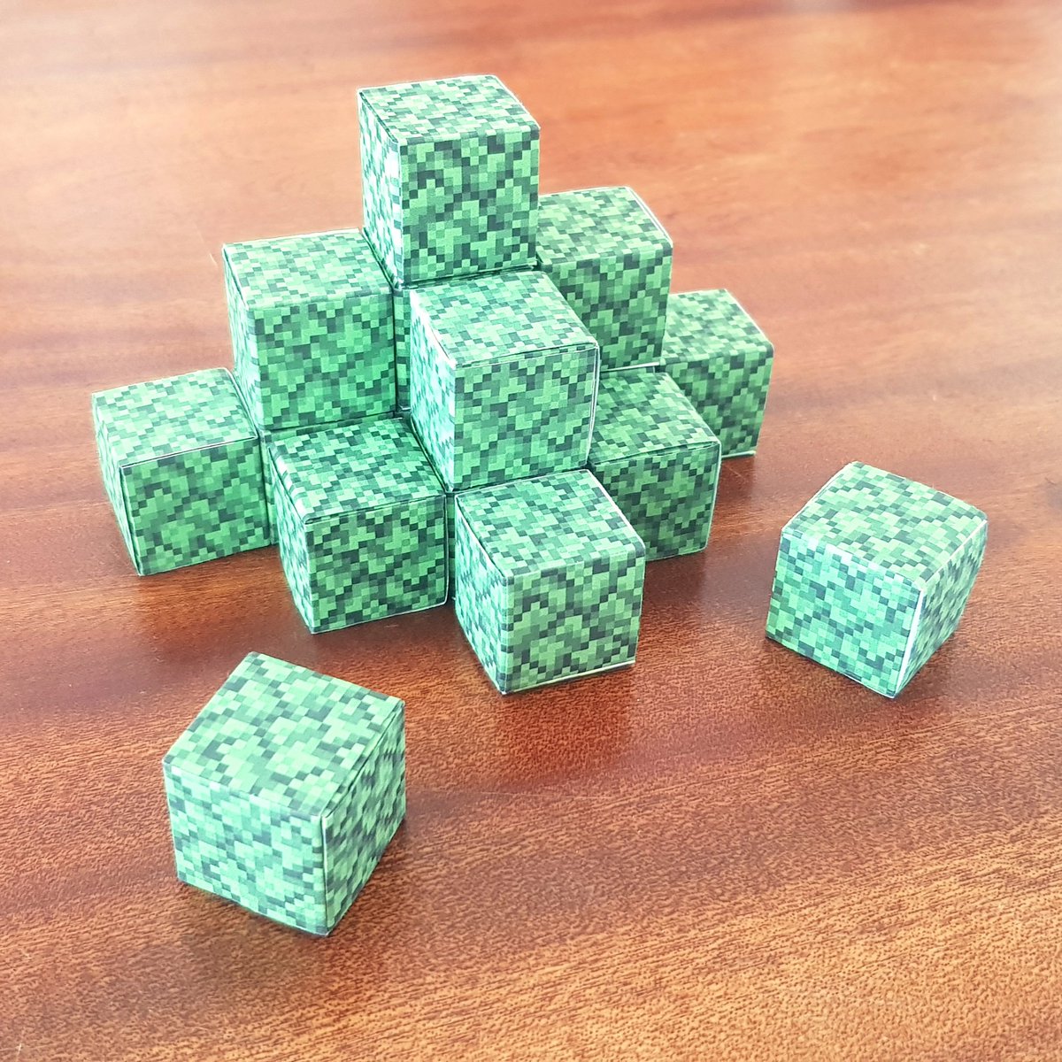 Making more Minecraft paper cubes for an upcoming tree. I have most of the origami blocks for he leaves already.