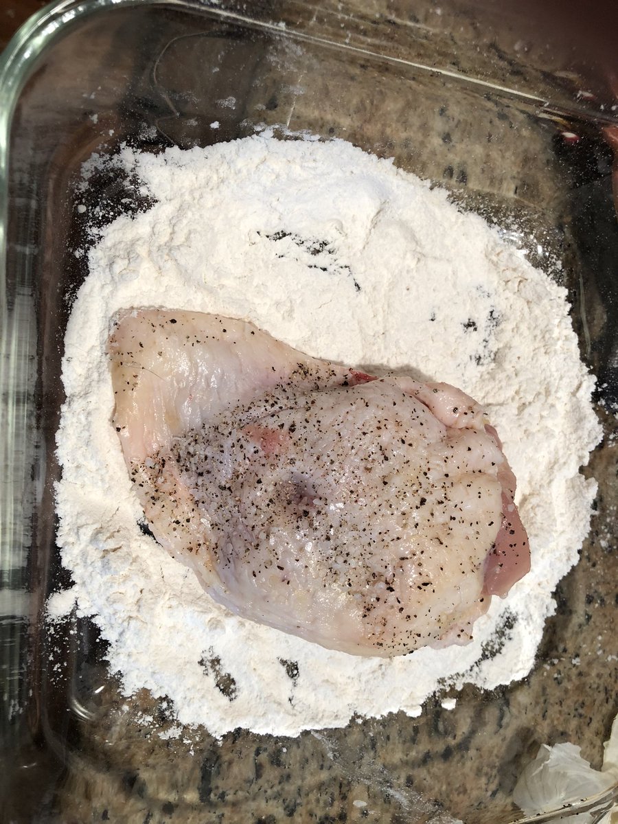 ebeth360's tweet photo. Shallots, garlic, lemon, chicken dredged in flour, remember to add herbes de Provence before arranging everything. I used wine instead of vermouth. #twitterbake https://t.co/FzHhoC73AV