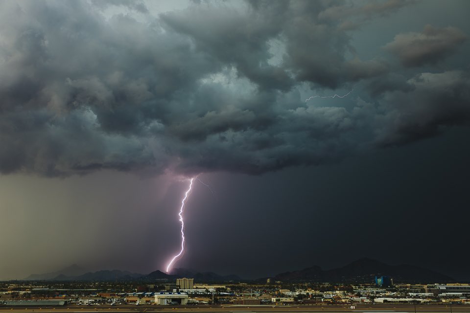 Chris_Frailey's tweet photo. A dusty bolt lands north of Phoenix Sky Harbor yesterday. Mother Nature brought #monsoon action early to the valley. The day time storms came in fast and would kill off any chances for night time fun. Here’s to a better chase today!! #azwx #azchasers https://t.co/6dRChxL7xc