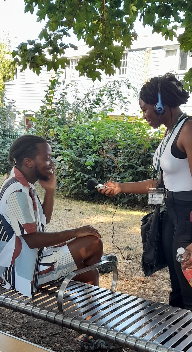 Reporter interviewing Spring Borough Center Youth Worker.