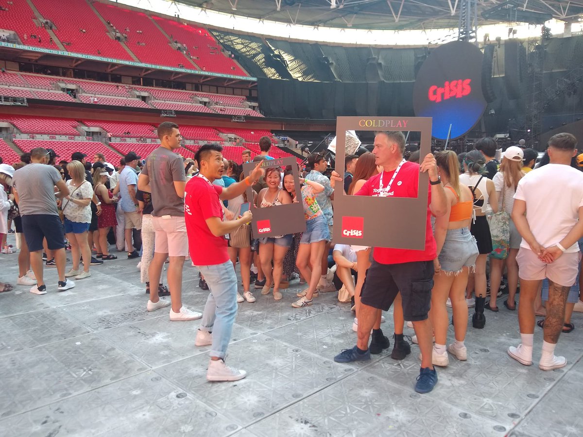 crisis_uk's tweet photo. The Coldplay fans are starting to arrive at Wembly for tonight's gig &amp; our stand volunteers are already busy answering questions about our work &amp; helping make memories with our Crisis/@coldplay frames. #ColdplayWembly #MusicoftheSpheresWorldTour https://t.co/k2NXAQeBeR