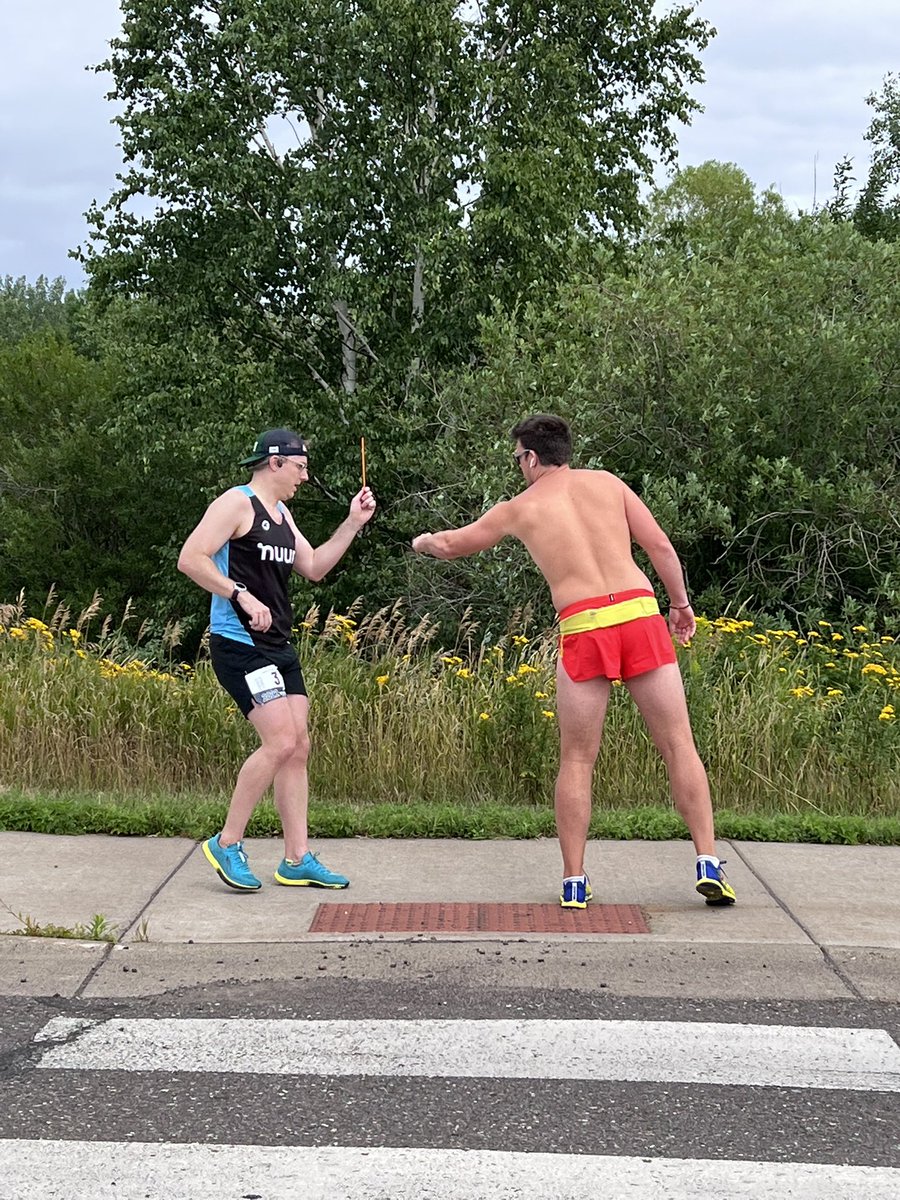 ragnarupdates's tweet photo. Brian with the last handoff to Rob wearing his short shorts as he heads out towards the finish line #RagnarMN #SuperiorRunning https://t.co/OzMKODzAdy