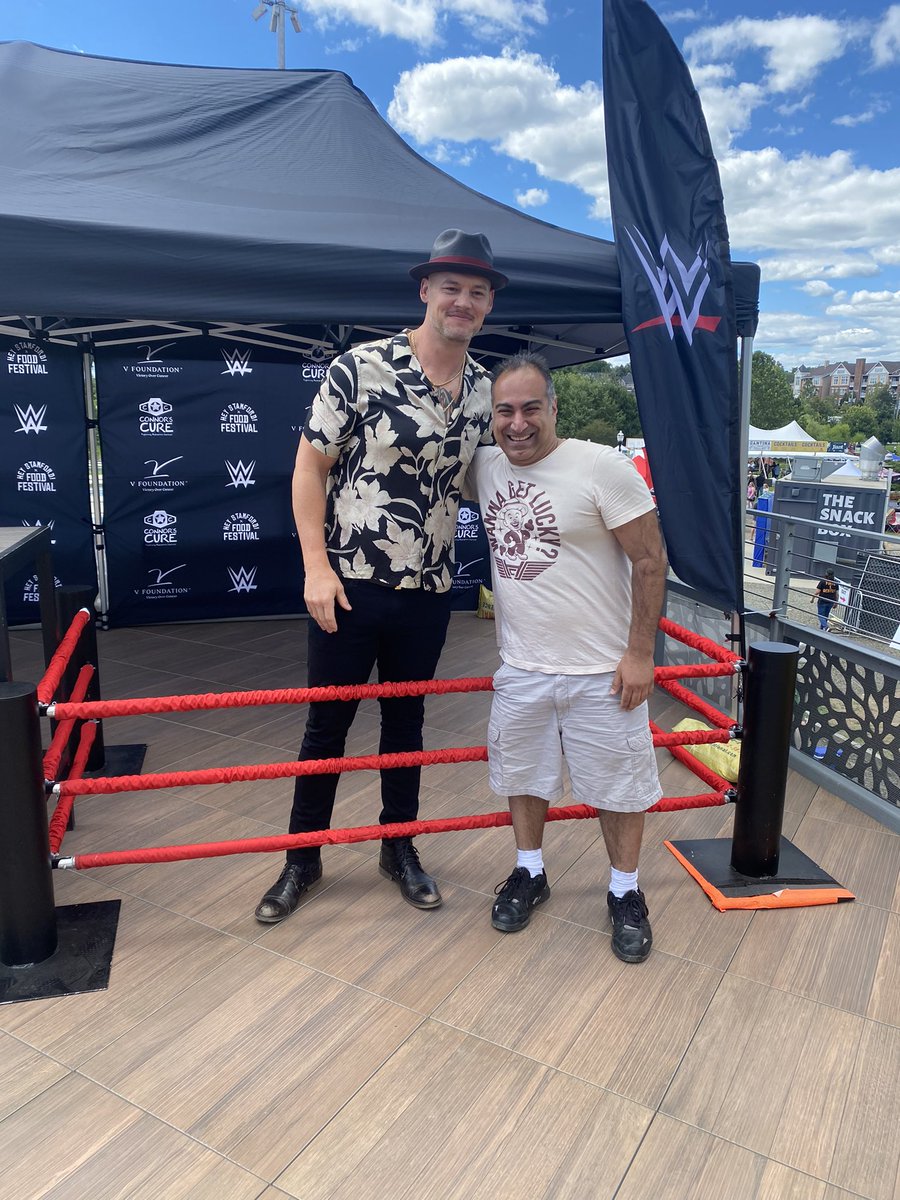 mikerandcom's tweet image. What an honor it was to finally get to meet my favorite wrestler @BaronCorbinWWE today! Had to take pics with him in both my #WannaGetLucky t-shirts &amp;amp; got to help support the Connor’s Cure foundation in the process! #HappyCorbin #BaronCorbin #WWE #SmackDown
