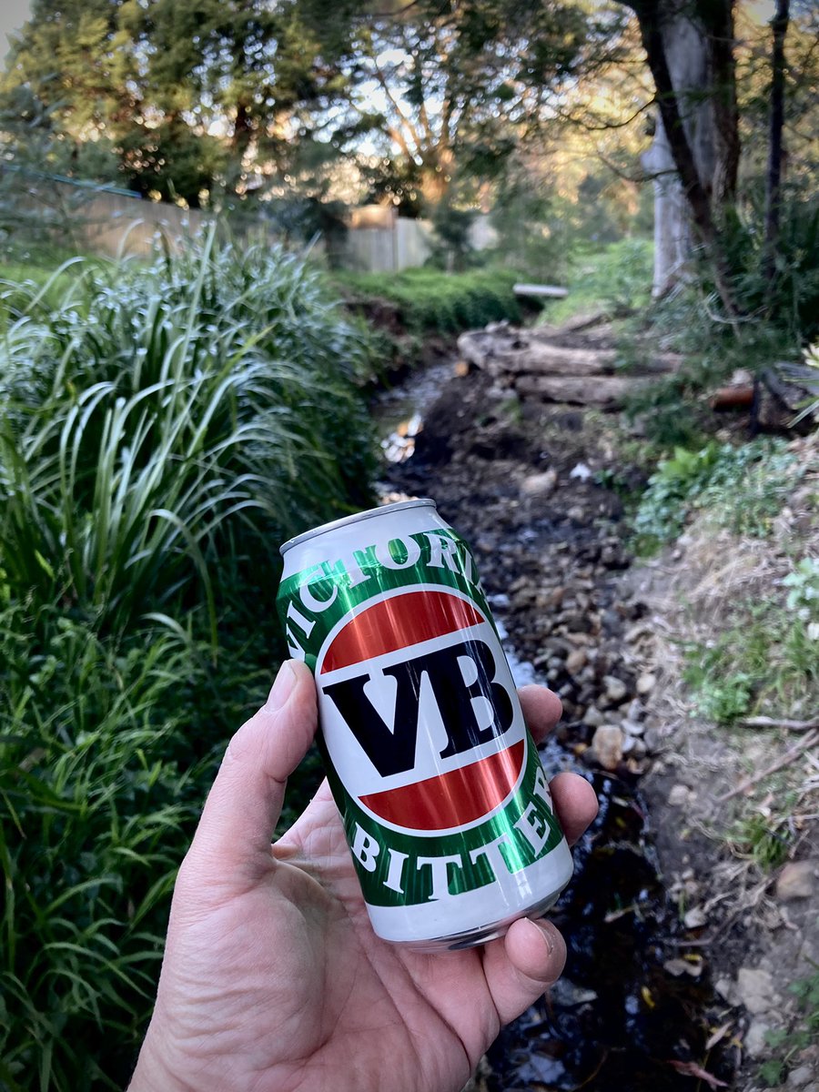 LeisureCoaster's tweet photo. After a couple of weekends of dragging logs a few hundred metres, shovelling tonnes of silt and clay and hammering in a stack of star pickets, it was time to enjoy a beer on the newly remediated creek bank behind my place. #unanderra #bushcare https://t.co/UT8a6DPTxl