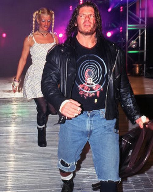CTropes's tweet photo. Just wanted to take a second to say I always appreciated Raven wearing comic book shirts throughout the mid to late 90s. https://t.co/ptwBoaUUzB