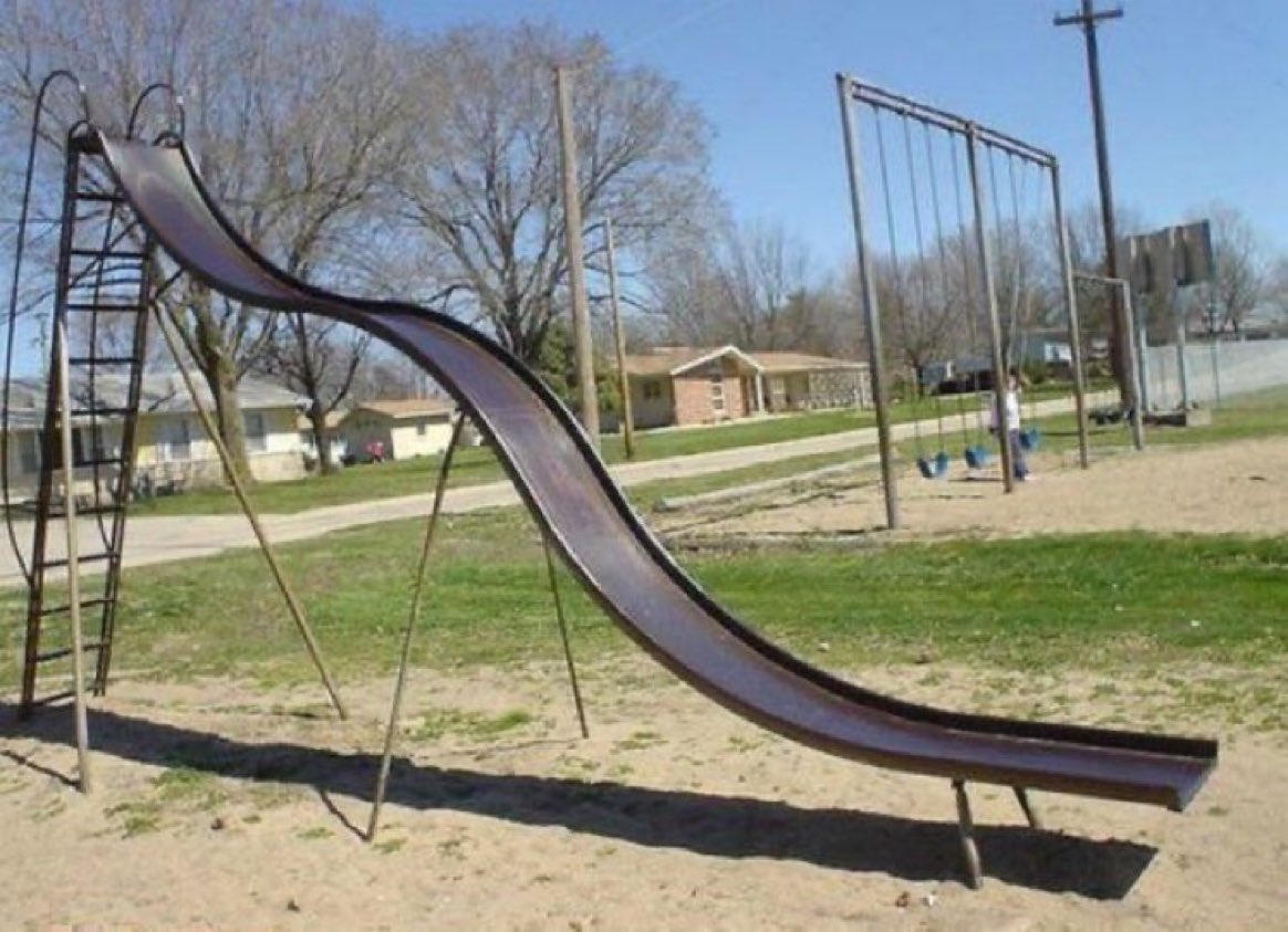 You know how playground slides have that rubber mulch around them now? We didn't need it because our falls were cushioned by the chipped teeth of children who previously had played there.