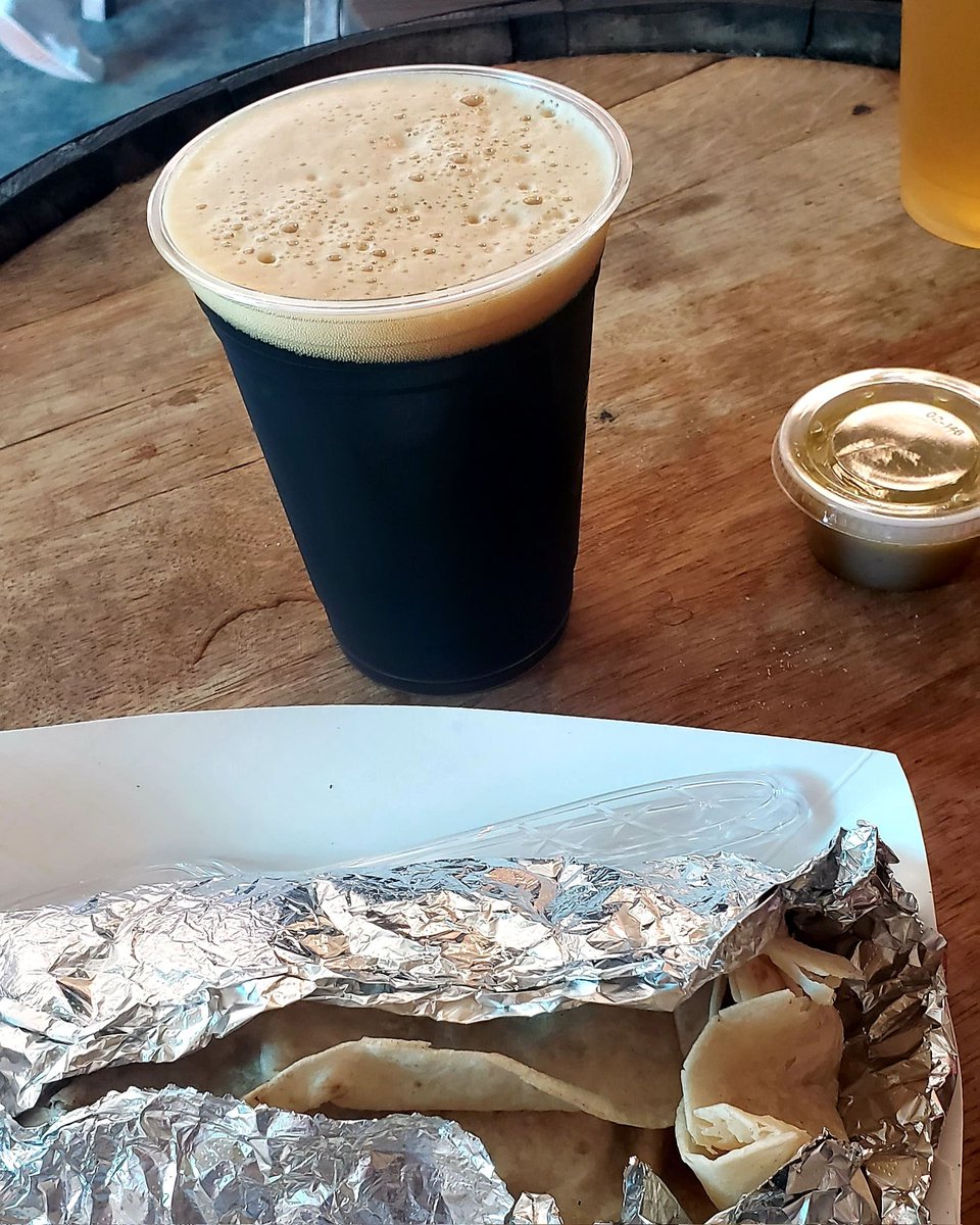 WarpCordova's tweet photo. #ExploringNC and found a brewery with food trucks! Dark chocolate stout and a surf n turf burrito. #writerlife https://t.co/Wya3i1TLHG